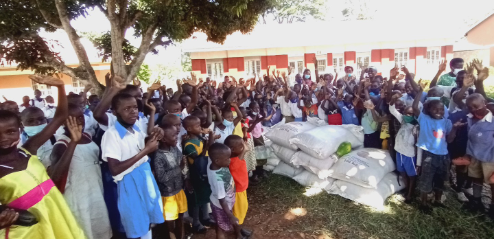 Pupils of Scared Heart RC primary school expressing joy after receiving food.