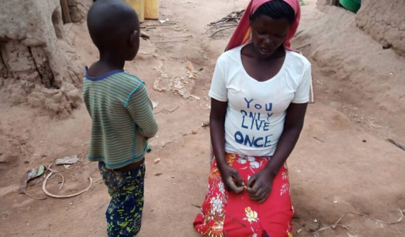 The torture 4-year-old-boy together with her mother at their home in Buvuma