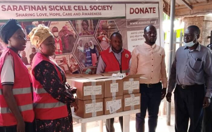 Sarafina Sickle Cell Society handing over the medicine to Mukono general hospital sickle cell clinic management.