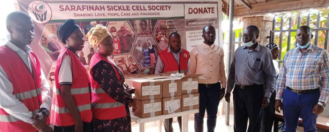 Sarafina Sickle Cell Society handing over the medicine to Mukono general hospital sickle cell clinic management.