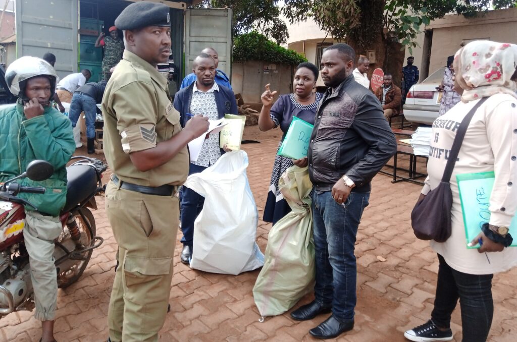 Sergeant David Alochi restricting distributors from leaving Mukono Police Division without security escorts.