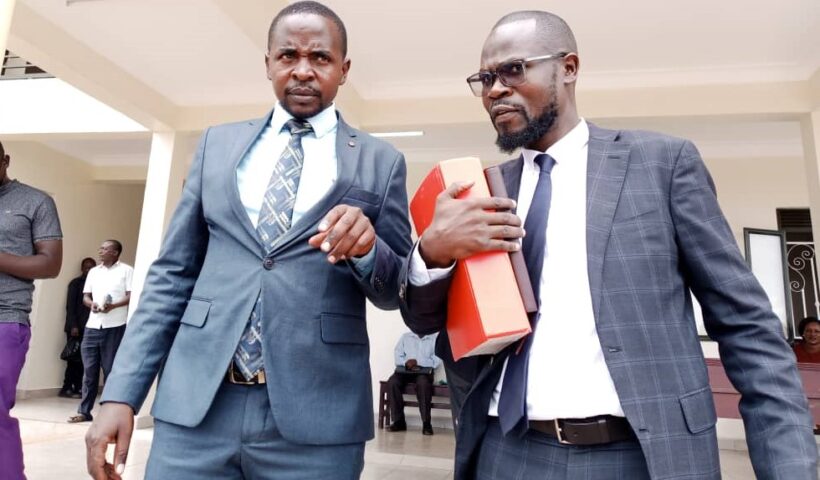 Hon. Fred Kayondo and his Lawyer, Erias Luyimbaazi Nalukoola after the court session.