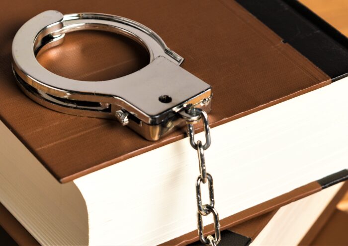 close-up-with-handcuffs-books