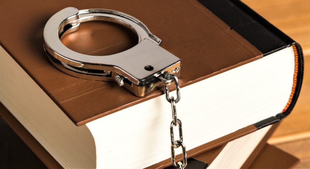 close-up-with-handcuffs-books