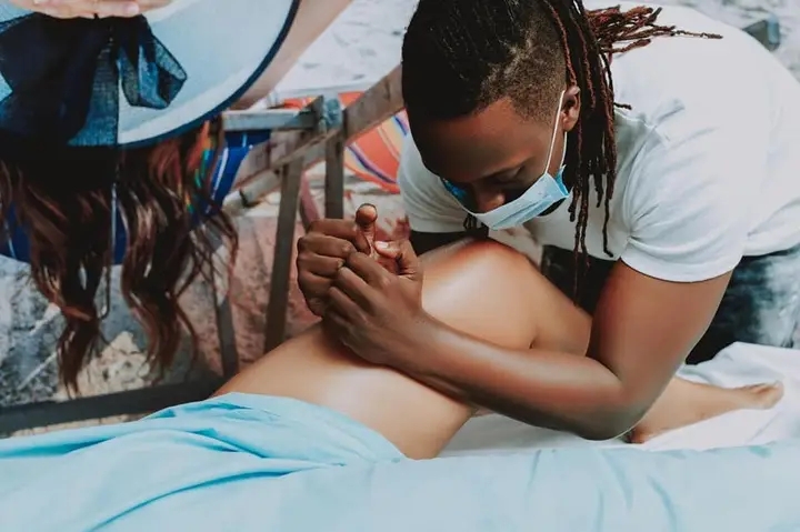 Bruno K massaging a woman