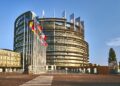 The European Parliament building in Strasbourg, France with a clear blue sky in the background
