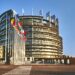 The European Parliament building in Strasbourg, France with a clear blue sky in the background