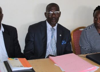 Elizabeth Namanda, Mukono CAO next to Rev. Peter Bakaluba Mukasa and his Vice LC5 Chairperson, Asuman Muhumuza.