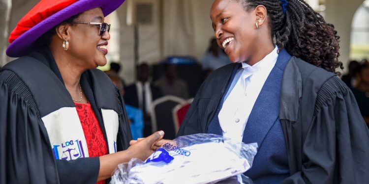 Justice Irene Mulyagonja, Court of Appeal Judge and Chairperson of the Uganda Law Council with the overall Best Student, Aine Linda Agnes. She received the Chief Justice's Award.