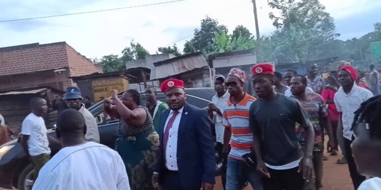 Mukono North MP and his supporters before they were dispelled from Kanikwa Village