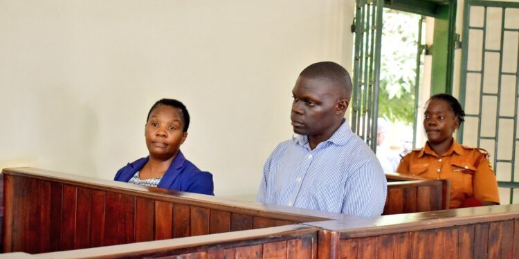 Ndejje town clerk and parish chief before court.