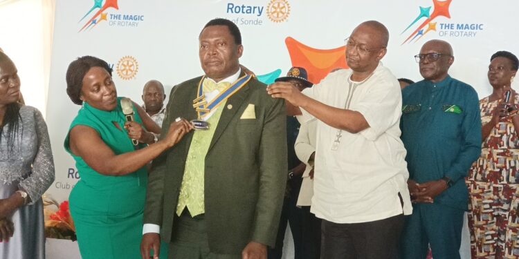 Dr Charles Olaro being decorated as nelwy elected President of Roatry Club of Sonde