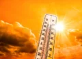 heat-wave-concept-heat-wave-concept-showing-glowing-yellow-sky-thermometer-