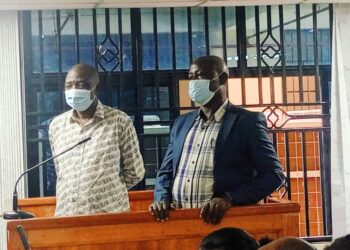 James Muganza (Left) Jinja District Commercial Officer and Charles Basoga the Chairperson of Busoga Growers Cooperative Union appearing in Court.