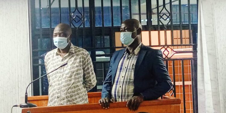 James Muganza (Left) Jinja District Commercial Officer and Charles Basoga the Chairperson of Busoga Growers Cooperative Union appearing in Court.