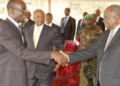 Grace Igaga shakes hands with the late former Kenyan President , Mwai Kibaki. Makerere Unversity Photo