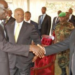 Grace Igaga shakes hands with the late former Kenyan President , Mwai Kibaki. Makerere Unversity Photo
