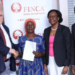 FINCA impact CEO Jeff Flowers on left with new FINCA Ambassador Jent Mudoola in the middle and Olive Lumonya board chaiperson together with FINCA Managing Director James Onyutta