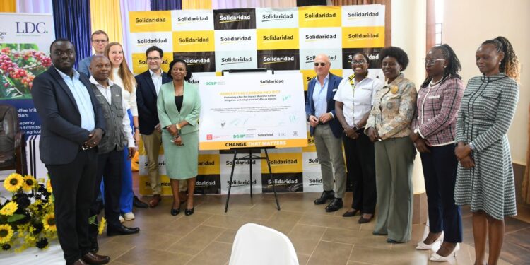 Danish Embassy, Louis Dreyfus Company (LDC), Solidaridad officials posing for a photo after the Carbon Harvest scheme launch.