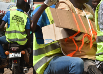 Bodaboda riders demonstrating how to save road accident victim.