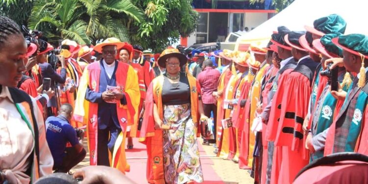 Reverend Professor John Chrysostom Maviiri, the guest of honor and Associate Professor Dr. Rose Nanyonga Clerke, the Vice Chancellor of Clarke International University heading the procession