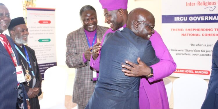IRCU members welcoming the EC Chief, Justice Simon Byabakama during their retreat at Mukono