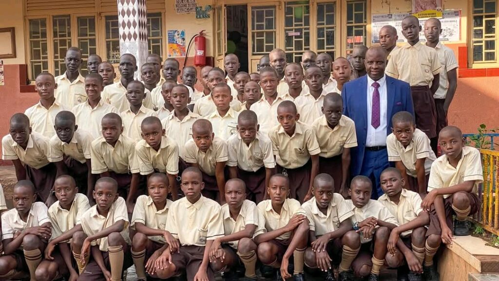 P. 7 Candidates of Rapha Primary School posing for group photo with headteacher before sitting exams last year. UNEB has witheld results for 100 candidates that sat at the school. Courtesy photo.