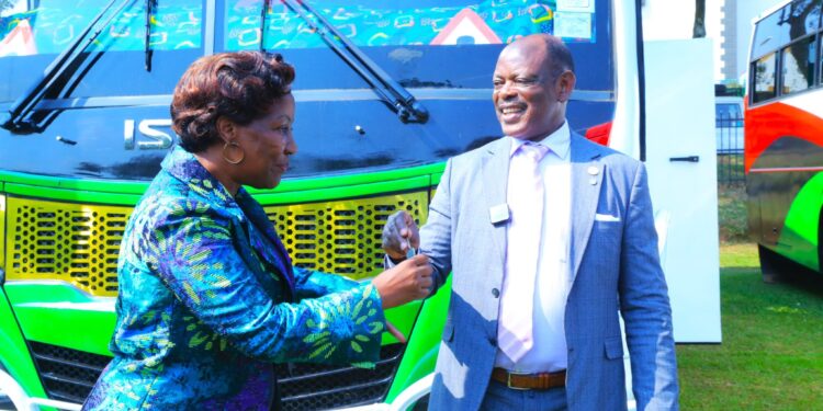 Prof. Nawangwe handing over bus keys to the collage principal