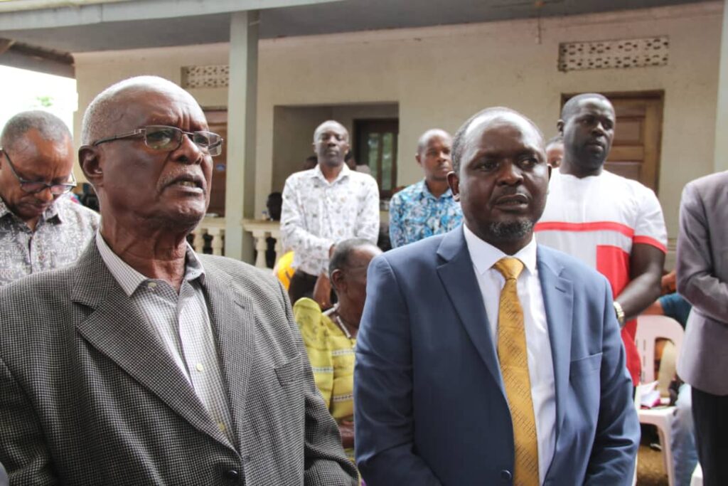 Amb. Nsambu and Hon. Gerald Ssendawula during the burial.