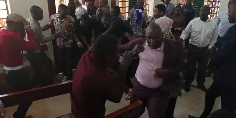 Suspected state operative punching civilians.