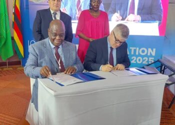 UCAA Director General Fred K. Bamwesigye signing a management service agreement with ICAO Secretary General Juan Carlos Salazar.