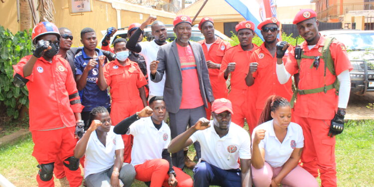 Daniel Lugoloobi posing for a photo with some of supporters.