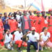 Daniel Lugoloobi posing for a photo with some of supporters.