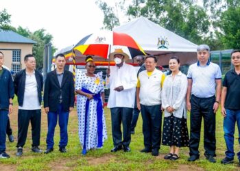 Museveni posing a photo with various investors recently.