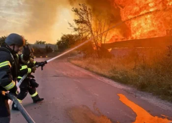 Firefighters battled blazes ignited by explosions in the Kyiv region.