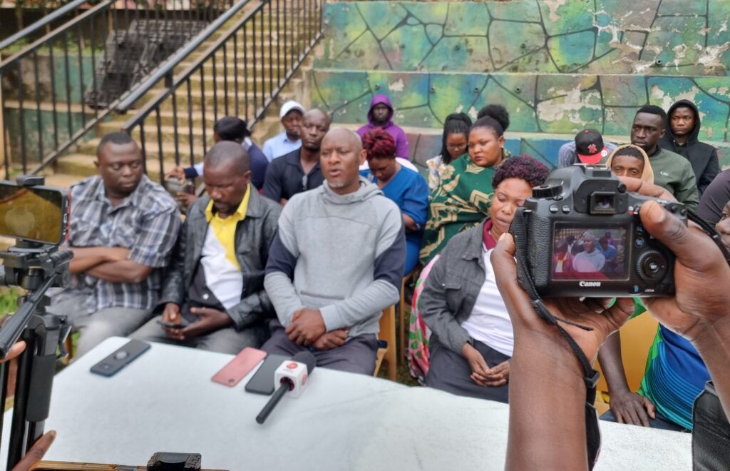 A section of NRM members addressing the media
