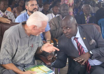 Pastor John Privitt talking to Pastor Samuel Lwandasa