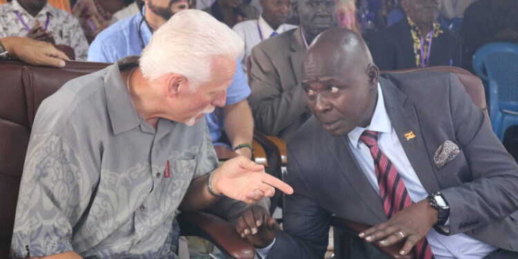 Pastor John Privitt talking to Pastor Samuel Lwandasa