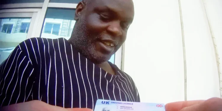 Mwesigwa displays his UK driving licence, claiming he once worked as a London bus driver.
