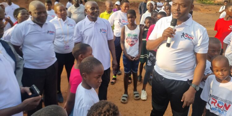Mukono North NRM candidate Ronald Kibuule addresses participants at the Good Samaritan Run at St. Andrew’s Church of Uganda, Mbalala.