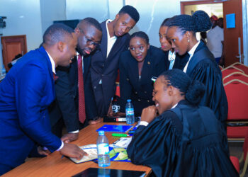 Law students brainstorm ahead of the second round of the moot competition
