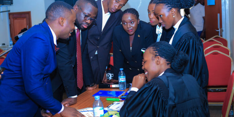 Law students brainstorm ahead of the second round of the moot competition