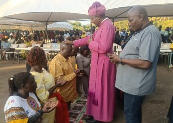 Religious leaders praying for Kibuule