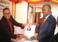 SSekikubo receiving nomination forms from Mukono Returning Officer