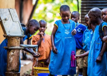 Pupils of Kayunga Girls’ Primary School in Kayunga District fetch and drink water from a borehole recently constructed at their school.