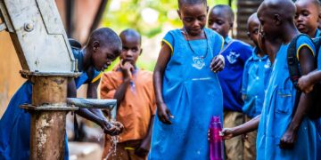 Pupils of Kayunga Girls’ Primary School in Kayunga District fetch and drink water from a borehole recently constructed at their school.