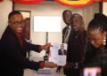 The Returning Officer hands over nomination forms to Robert Maseruka after his nomination for the Mukono South parliamentary seat.