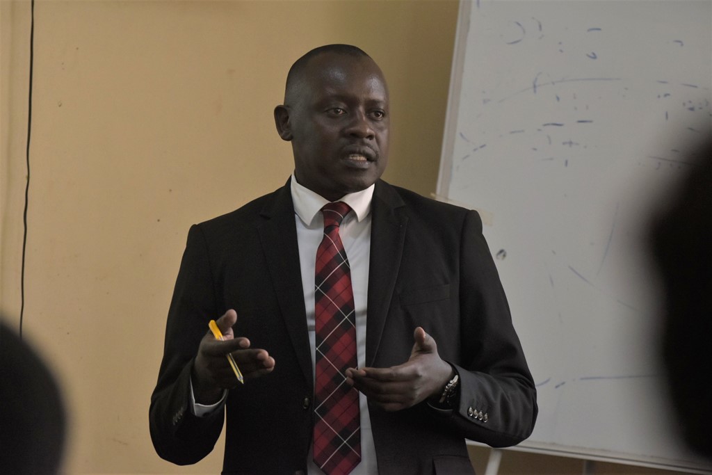 Rogers Golooba, the Senior Probation and Welfare Officer-MGLSD, addressing statkeholders in Jinja. Photo by Davis buyondo