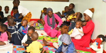 Some of the caretakers at the Lugazi central market day care centre.
