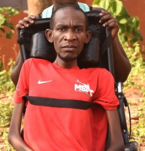 Joseph Sentamu,who is battling MND, seeking medical support. Photo by Davis Buyondo